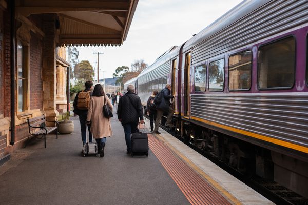 Travellers boarding a regional train